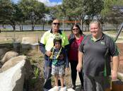 Shane Moore, Rennie Moore, Kelly Rowe and Elias Moore check out the playground and barbecue facilities at the revamped Dumaresq Dam before its official opening on Saturday, April 13.
