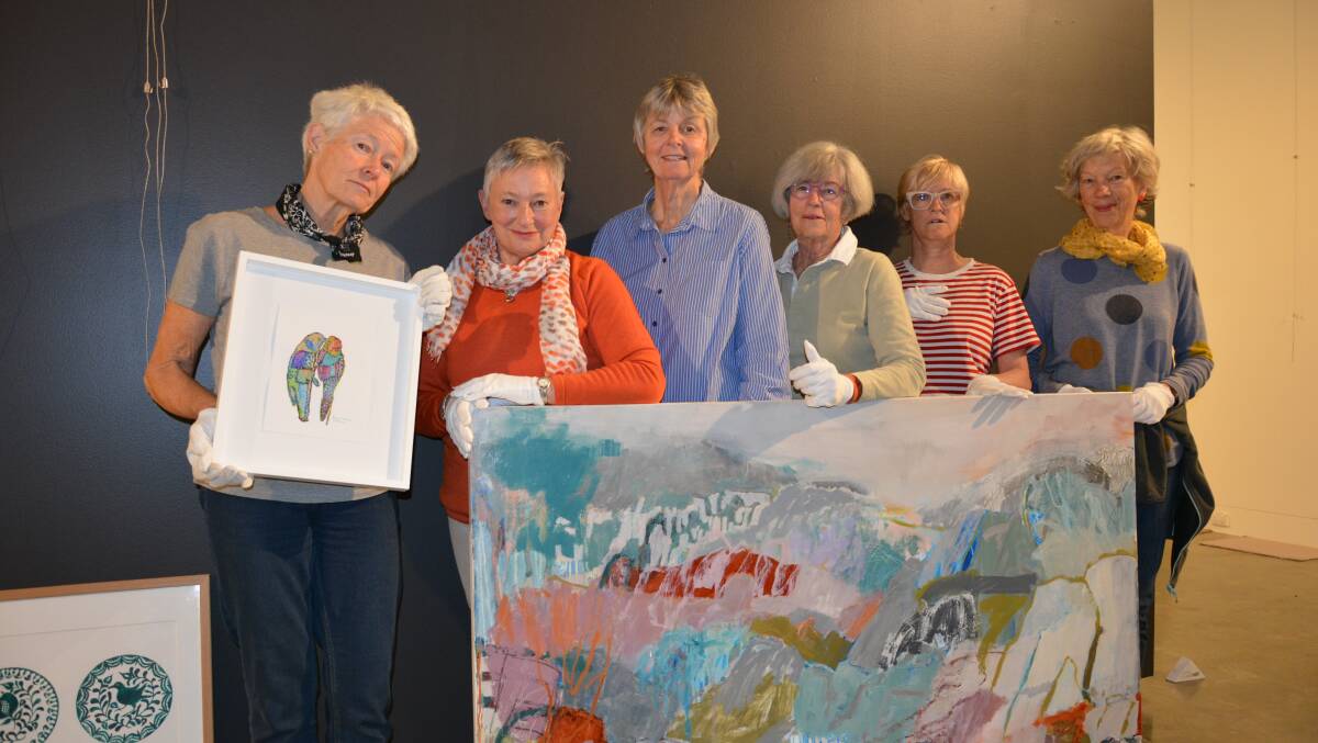 Packsaddlers from left Merran Pearson, Moira Lloyd, Sue Fisher, Liz Fulloon, Michelle Schouten and Alison Wright with some of the art work will be on display and for sale during Packsaddle 2023.
