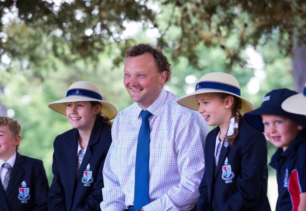 LEARNING: Head of NEGS Junior School Andrew Travers with students. NEGS is renowned for its supportive learning environment. Photo SIMON SCOTT