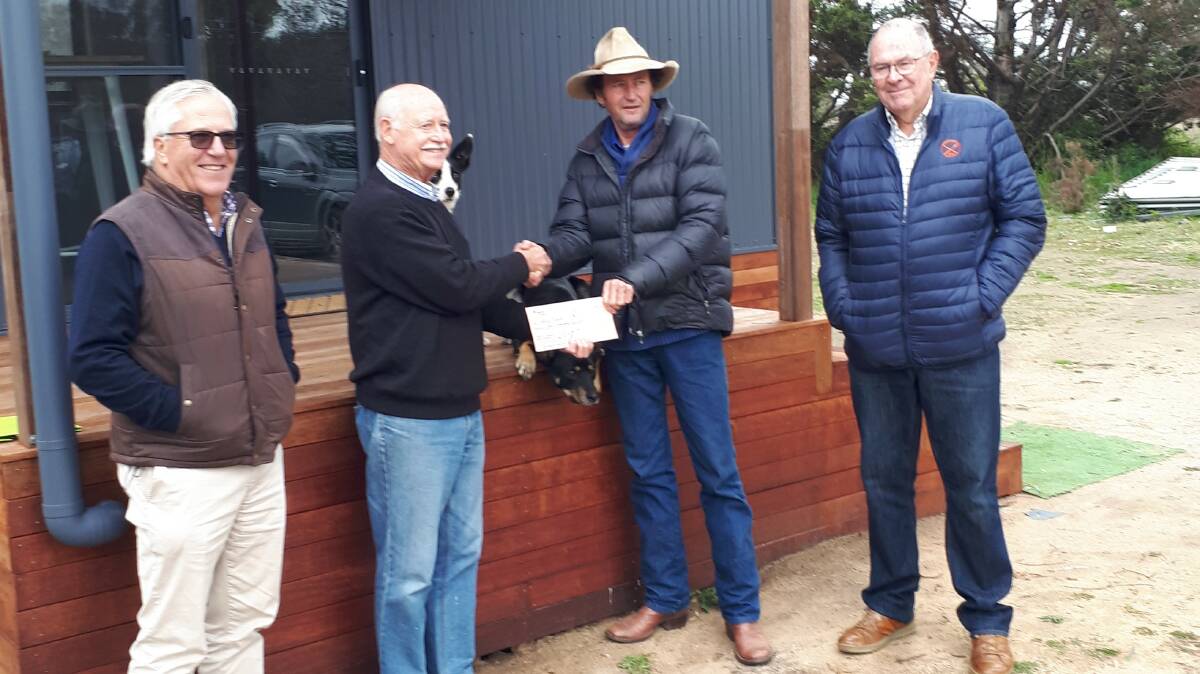 Rotary president Hugh Beattie presents Bernie Shakeshaft from BackTrack with the cheque alongside president elect Bernie Perkins (left) and service director Ed Wright (right).