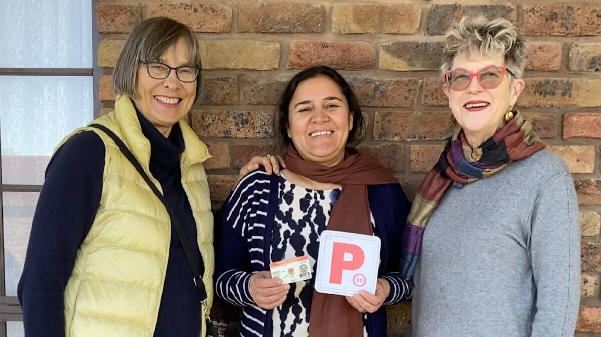 Khawla Abas (centre) with Sanctuary members Astrid Knirsch (left) and Kerry Dunne (right).