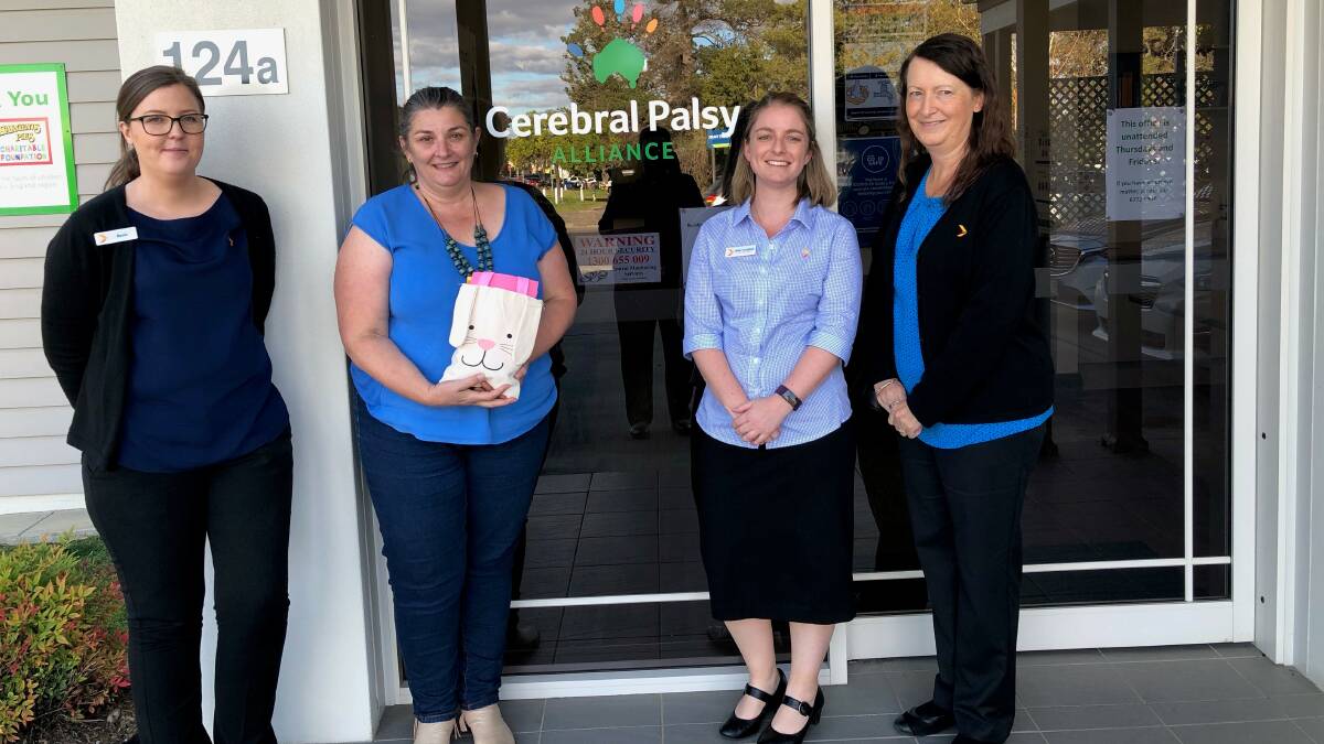 Employees from Greater Banks Armidale branch, Rosie Smith, Megan Towie, Nikki Armfield and Sharon White, dropping off some of the Easter gifts to CPAs therapy centre in Armidale this week.