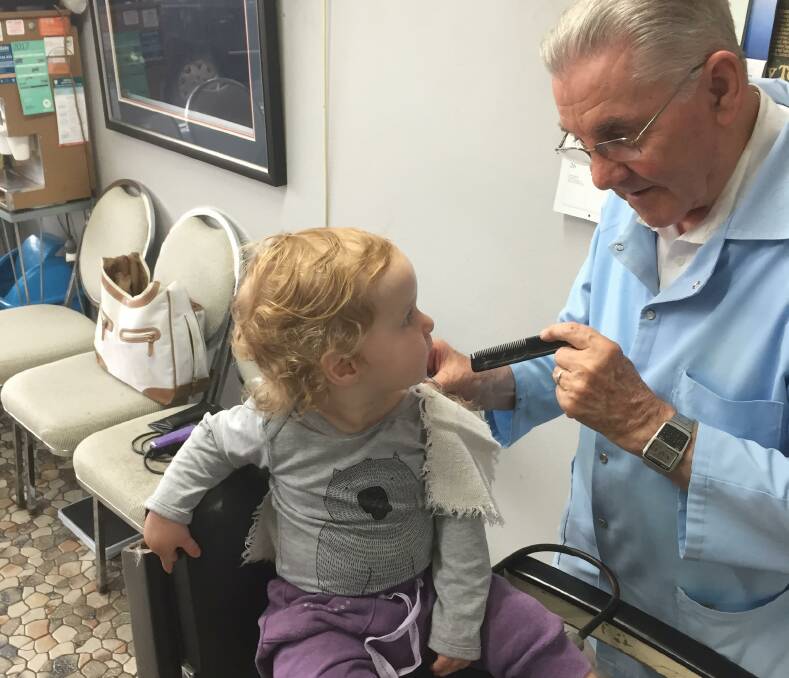 Hamish Elliott becomes the fifth generation in his family to get his hair cut by Roy Cowley.