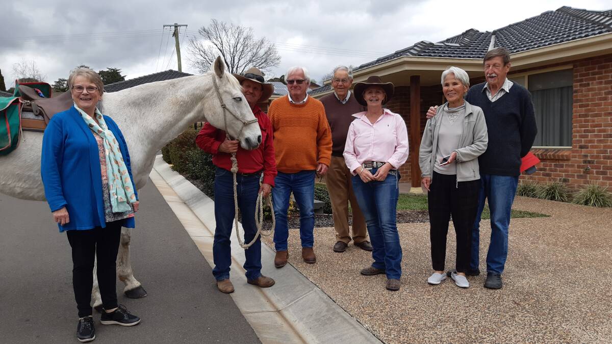 Sue Nelson (third from right) brought her horse Happy to the village, to put a smile on residents' faces, during the COVID lockdown, (from left) Margaret Hadfield, Anthony Nelson, Rob Hadfield, Hugh Pottie, Michiko Jehne and Claus Jehne.
