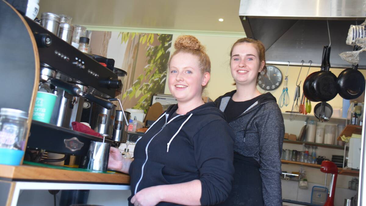Rachel Goodwin and Bronte Bourke at Fresh@110, which has remained open for takeaway coffee.