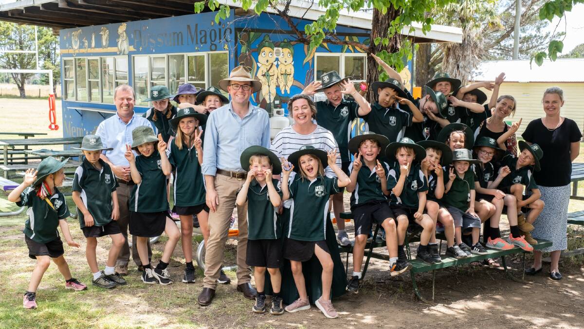 Kellys Plains Public School Principal Mark Annetts, Northern Tablelands MP Adam Marshall, P&C President Stella Single, and teachers Catherin Szacsvay and Bec Bourke celebrate the funding win with the schools students.