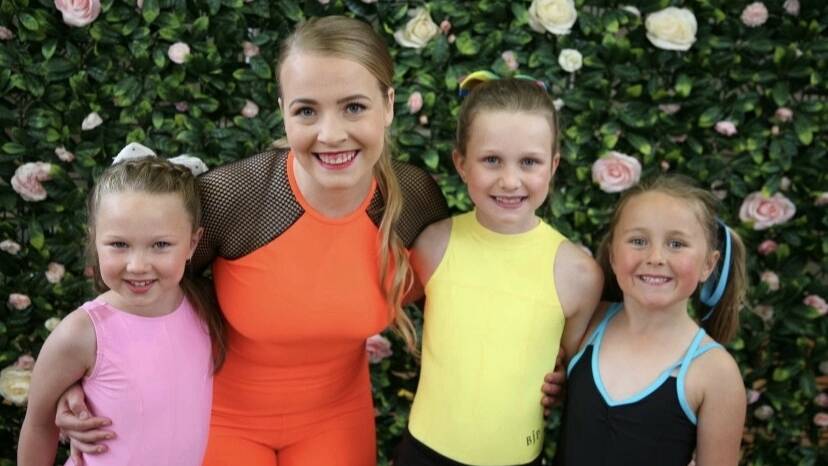 Armidale Physie Club associate Charlotte Seren with three of her students.