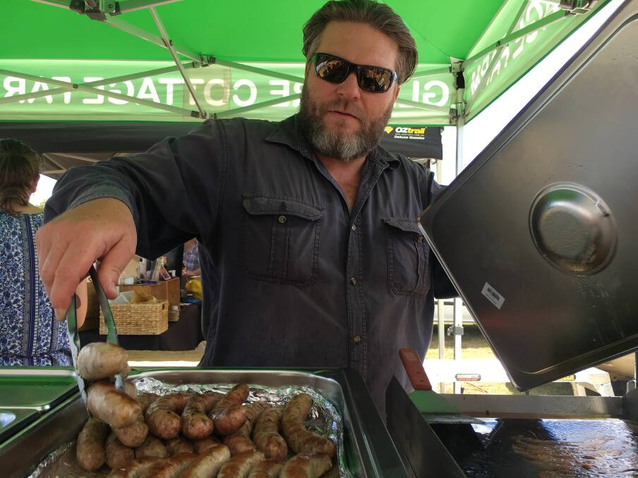 LOCAL SNAGS: Gabe Saats' gourmet sausages at the Glenore Cottage Farm stall were among the many local producers at last weekend's Seasons of New England, where thousands of people tasted food from the region.