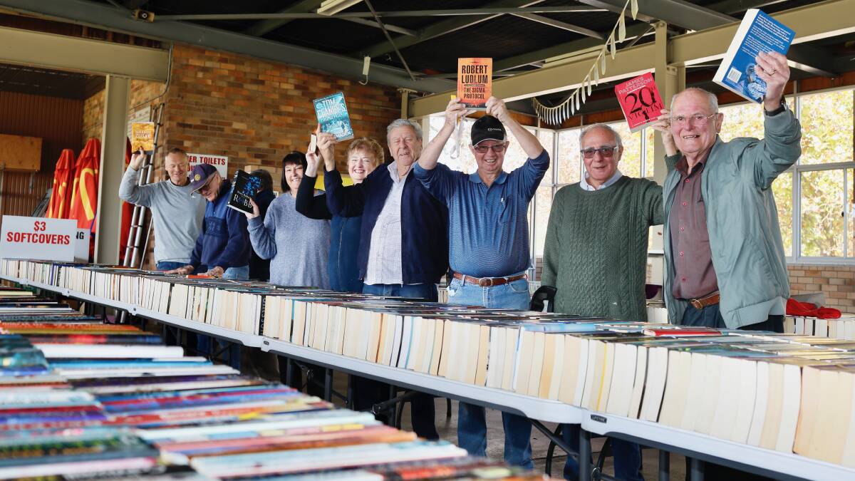FAIR EFFORT: Rotary Club volunteers set up the book fair this week at Armidale Jockey Club. Picture: Supplied