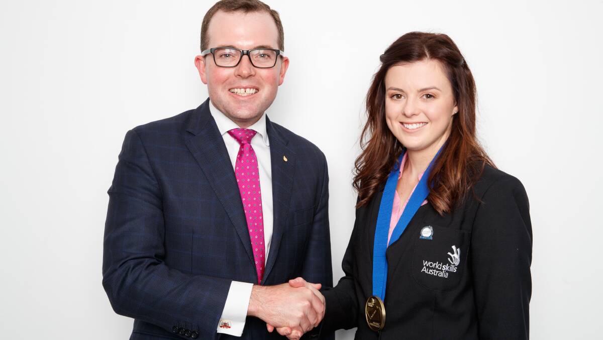 Northern Tablelands MP and Minister responsible for TAFE NSW Adam Marshall congratulating Courtney Baldwin on her hairdressing Gold medal at the 2018 National WorldSkills Championships.