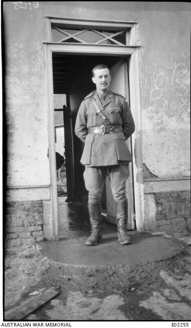 Lieutenant Colonel H F White DSO, 35th Battalion, standing in front of his quarters at Lahoussoye. White handled the Progressive Party pre-selection meeting with firmness and tact.