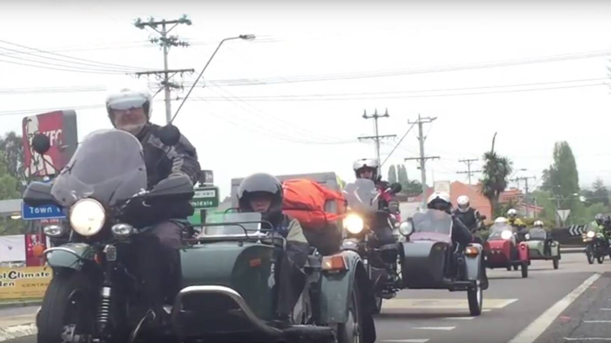 The motorbikes make their way down the highway.