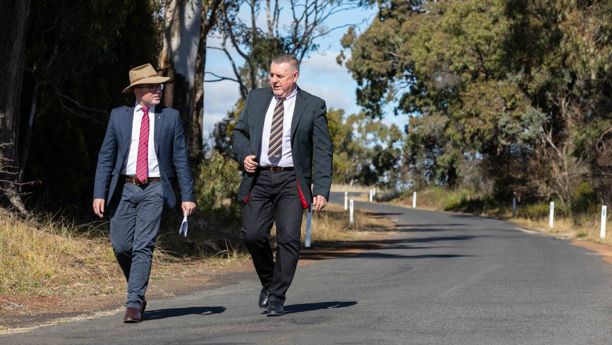 Northern Tablelands MP Adam Marshall and Uralla Shire Mayor Mick Pearce walking along Hawthorne Drive yesterday, which will receive $516,000 under round one of the State Governments new Fixing Local Roads program.