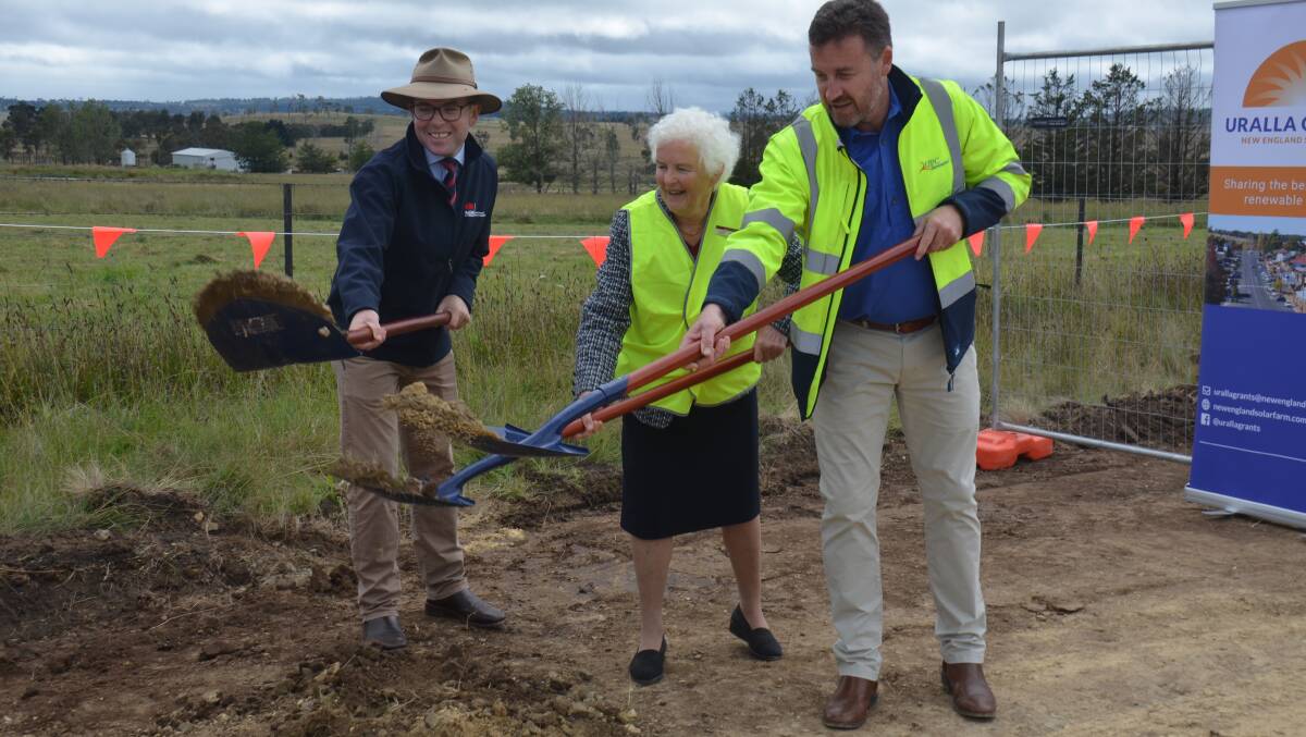 Northern Tablelands MP Adam Marshall, Uralla's deputy mayor Isabel Strutt and CEO of UP/AC Renewables Anton Rohner turn the first sods at the construction site.