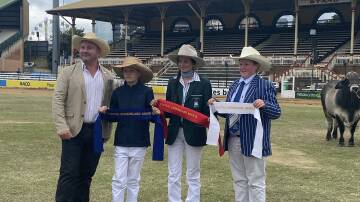 Lily McCosker (centre in green PLC Armidale team blazer) takes out second place in the 2022 Ekka Stud Beef Junior Judging event.