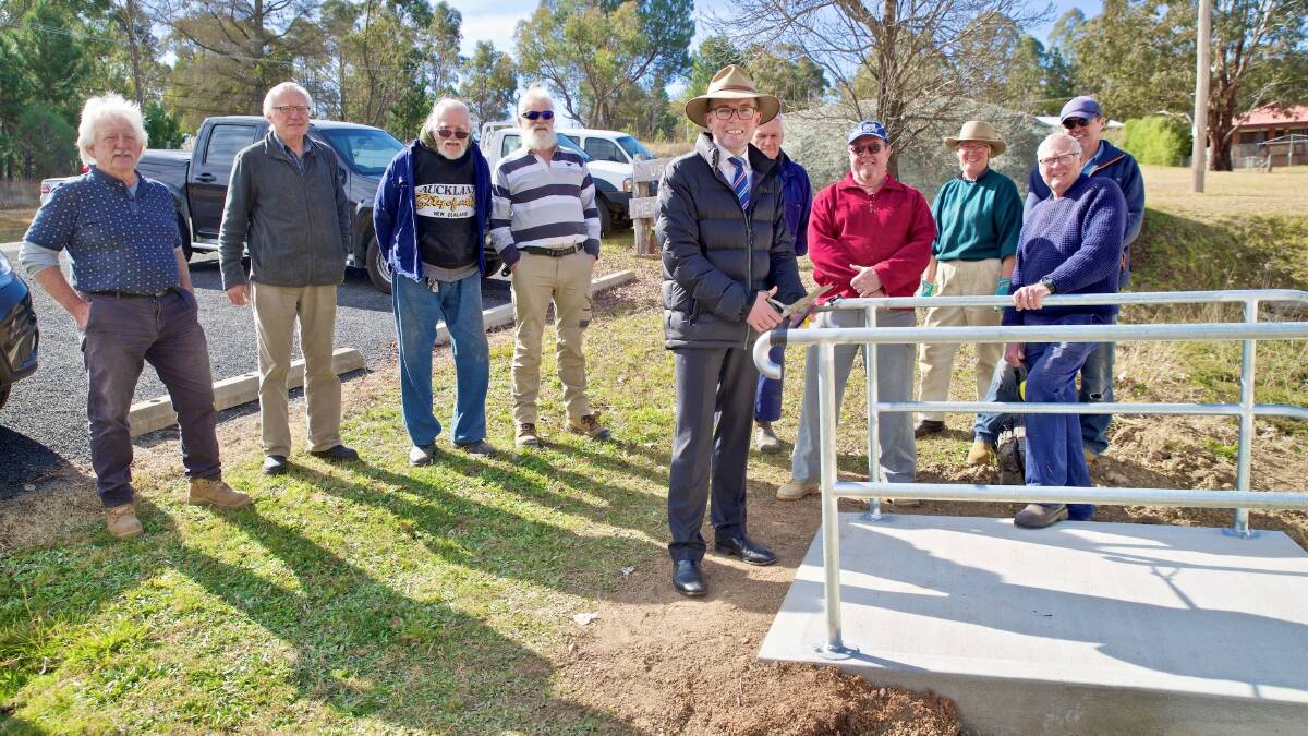 New steps at Uralla Mens Shed officially open as work now shifts to a $40,080 amenities upgrade, with Secretary Bruce Stubberfield, left, President Roland Bernett, Colin Armstrong, Chris Wayling, Northern Tablelands MP Adam Marshall,Chris Baker, Dennis Dougherty, Annie Lamb, Vince Scollen, foreground with hand on rail and Jim Walkinshaw.