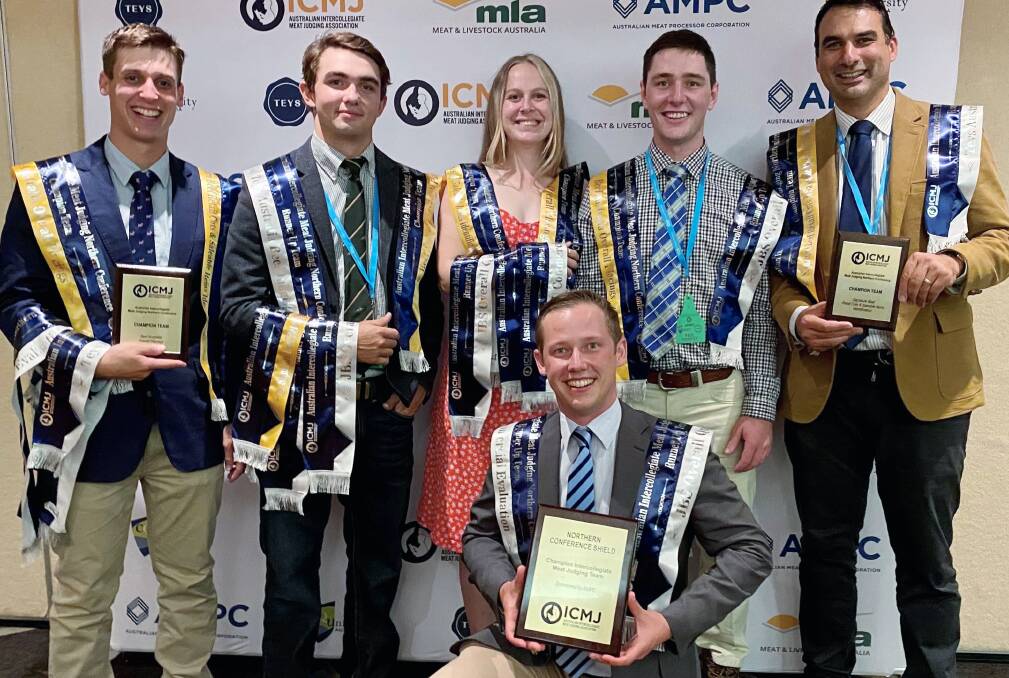 UNE's champion ICMJ team (from left) Jack Jansen, Nick Whip, Caitlin McDonald and Paul Murphy, with coaches Associate Professor Pete McGilchrist and Rob Muirhead (kneeling).