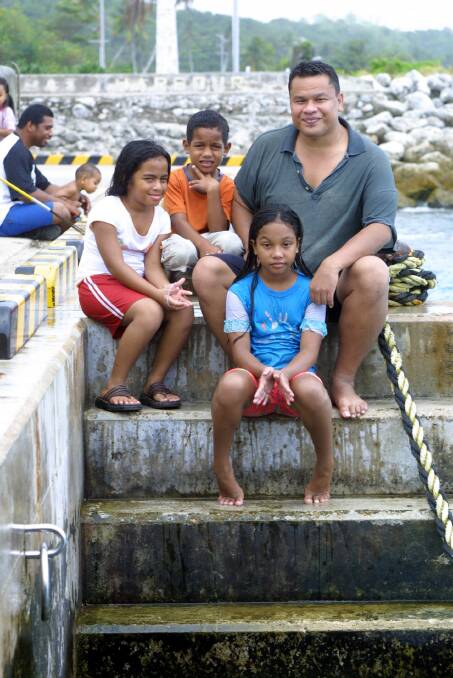 Nauru MP Sprent Dabwido with his children at Nauru harbour in 2005. Picture: Mike Gordon, The Age