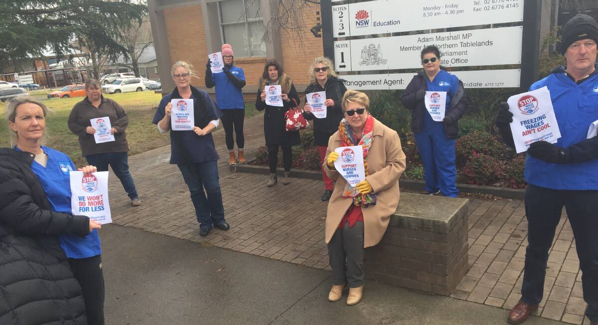 Armidale nurses held a protest outside Adam Marshall's electorate office on Tuesday morning. Picture: Laurie Bullock