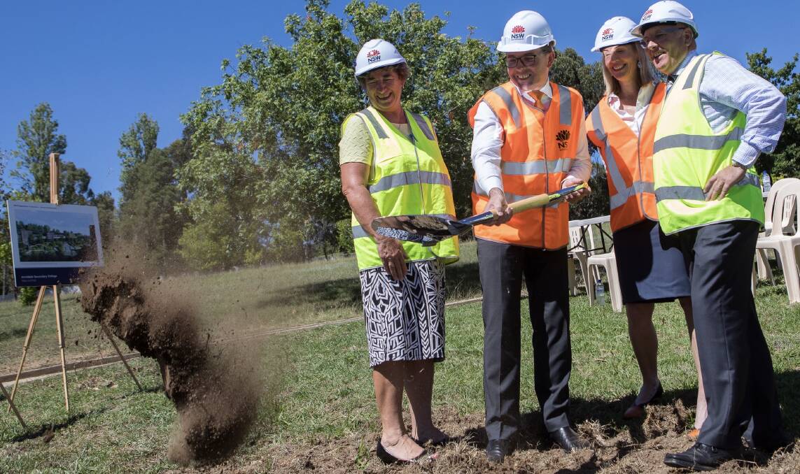 SHOVELLING: Project liaison officer Kris Croft watched State MP Adam Marshall turn the ceremonial first sod for the Armidale Secondary College with principal Carolyn Lasker and educational leadership director Pat Cavanagh.
