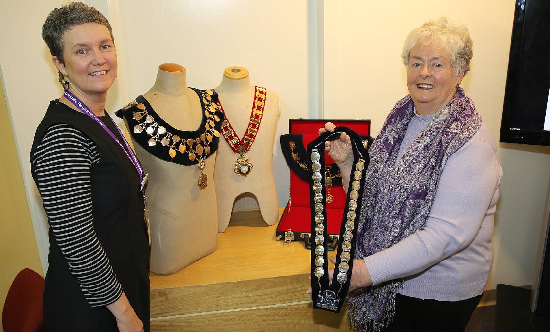 Armidale Regional Council’s Hayley Ward and Dot Vickery from the Guyra Historical Society with some of the exhibits.