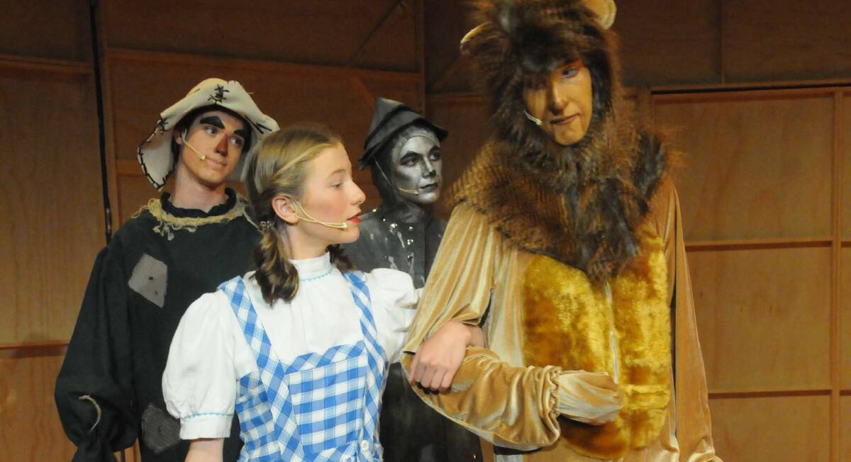 Dorothy (Emily Buntine), Lion (Rick Nutt), Scarecrow (Clancy Roberts) and Tin Man (Alexander Gibson) on their way the find the Wizard of Oz.