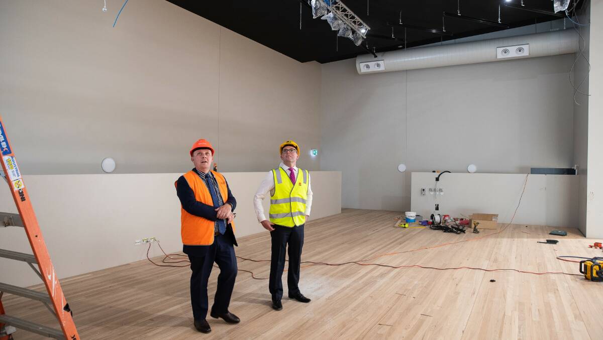 PROGRESS: NSW Department of Education Director Educational Leadership Matt Hobbs and Member for Northern Tablelands Adam Marshall inspect progress of the new large performance stage in the new $10.4 million Armidale Secondary College Multi-Purpose Centre. Picture: Supplied