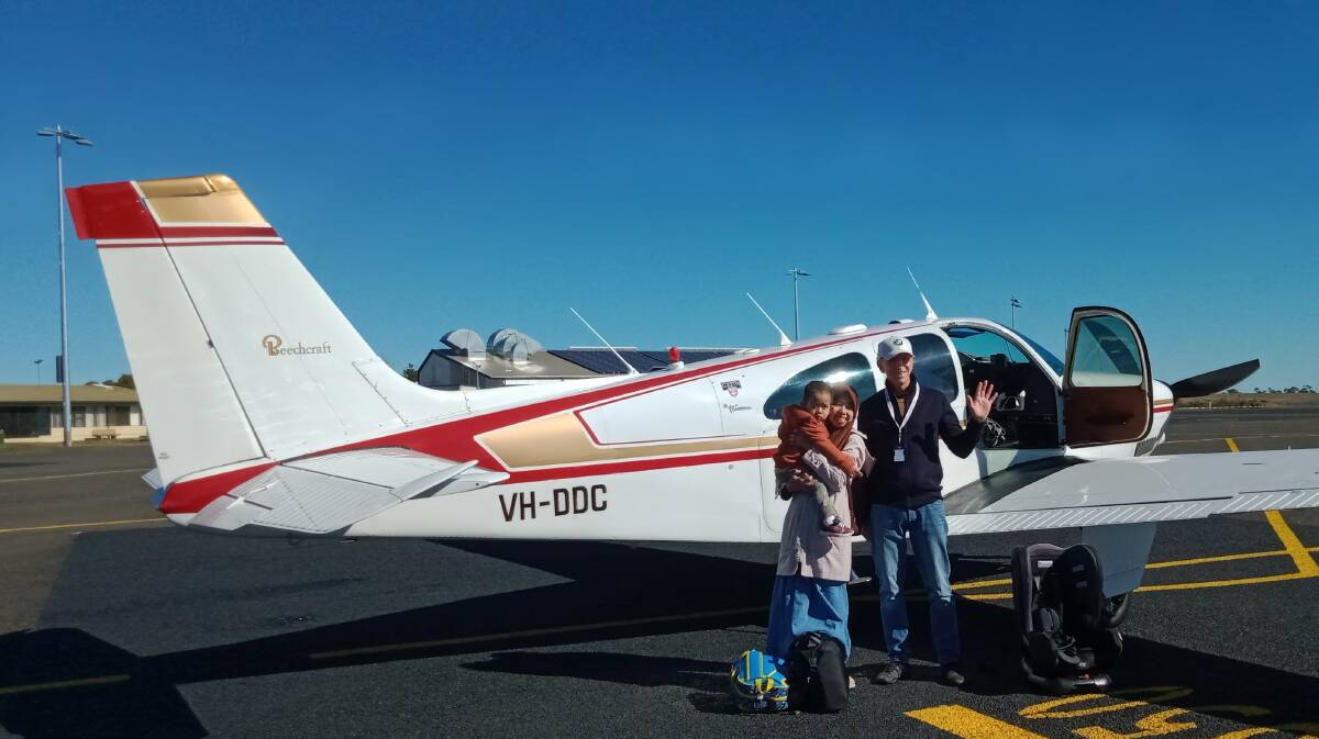 Wawat Rodiahwati and Arzanka with the Angel Flight pilot Neil.