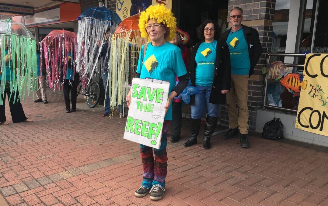 Vanessa Petersen had a message for the Commonwealth Bank on Saturday morning alongside other protesters, Maria Rommery and Peter O'Donohue (right). Also protesting are Francis Letters, Eveline Hughes, Amy Winrose, Tom Fisher, Eva Rommery and Tim Collins.