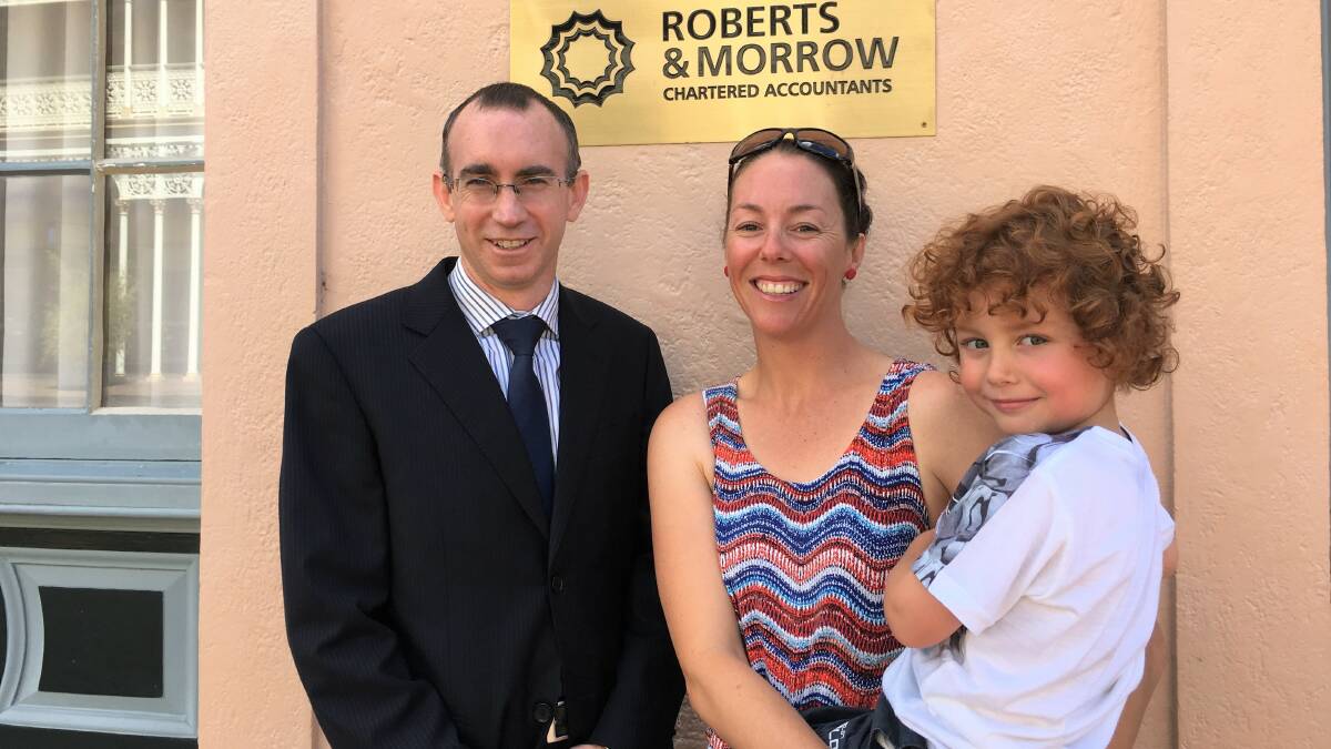 Roberts & Morrow Partner Paul Williams with Kirsty Toovey and her son Finn.