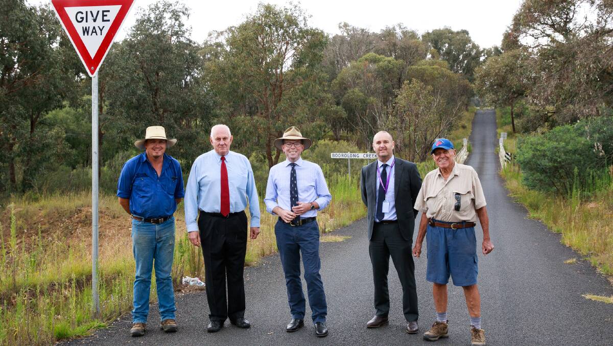 Celebrating funding to replace the narrow wooden Boorolong Creek Bridge on Wednesday (from left) local grazier Tim Light, Mayor Ian Tiley, Northern Tablelands MP Adam Marshall, Council general manager James Roncon and local farmer Chris Swindale.