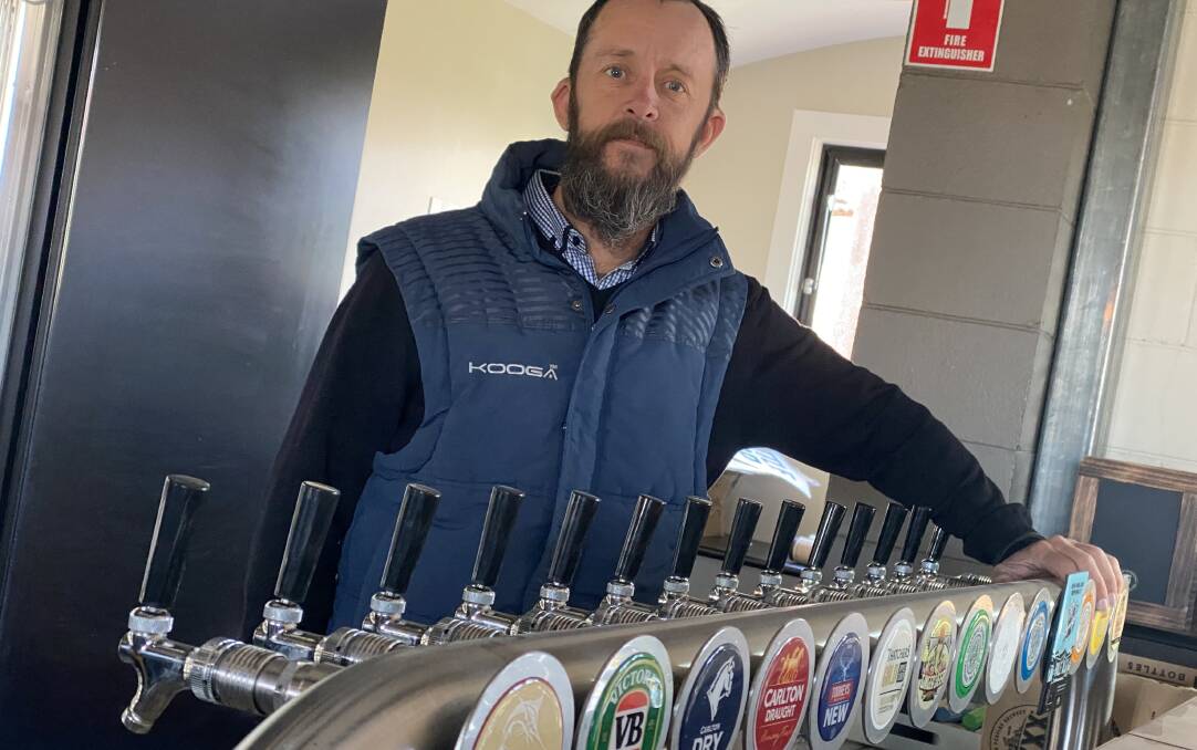 Railway Hotel licensee Robbie Porter behind the taps, which have not been used for a while now. Picture: Laurie Bullock