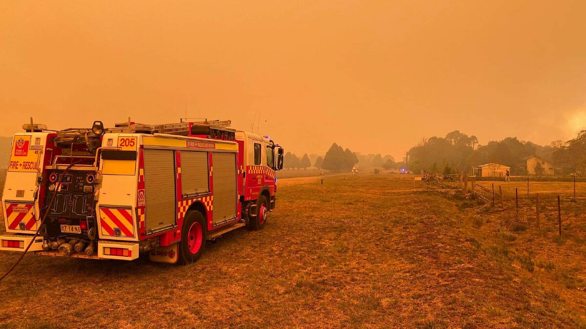 Inferno: Firefighters try and control the massive Guyra Road fire at Ebor last year. Picture: Fire and Rescue NSW Armidale