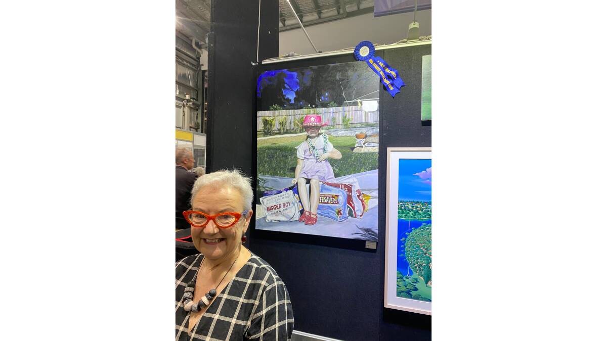 FIRST PRIZE: Andrea Gledhill with her winning painting at the Royal Sydney Easter Show. Picture: Supplied