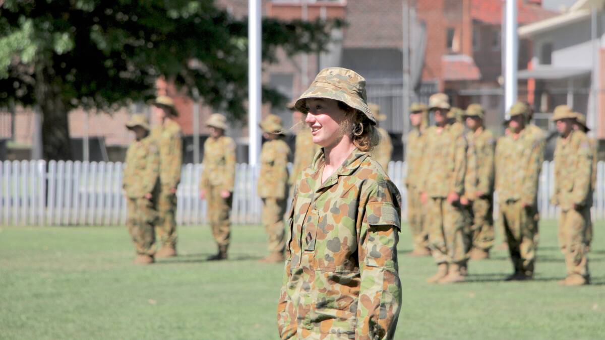 Lily Etheridge leads the TAS unit on parade after annual cadet camp.