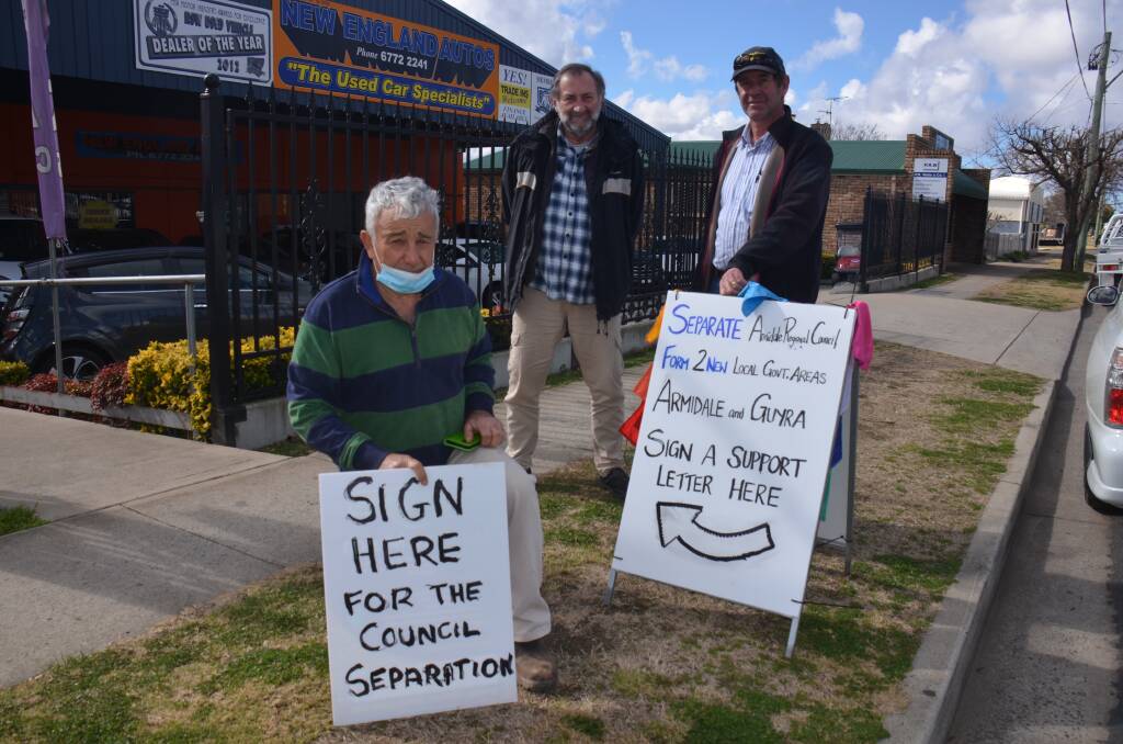 Gordon Youman, Terry Rolfe and Peter Heagney outside New England Autos where the Guyra group is encourage Armidale residents to support their move to end the amalgamation of Armidale and Guyra councils.