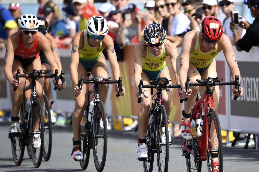 THAT'S RACING: Backhouse, out front, rued not having more company on the bike leg when she exited the water. Photo: AAP/Dean Lewins 