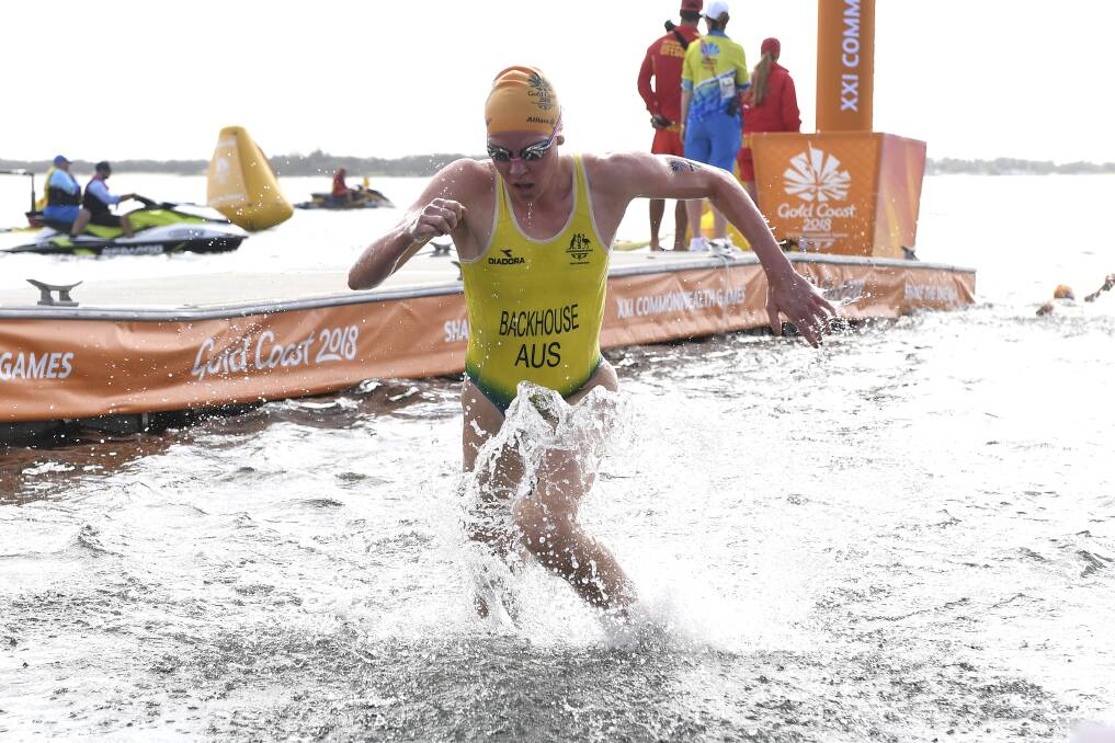 CREDITABLE: Gillian Backhouse of Armidale exits the swim leg during the women's triathlon at the Gold Coast Commonwealth Games. She finished ninth. Photo: AAP/Dean Lewins 