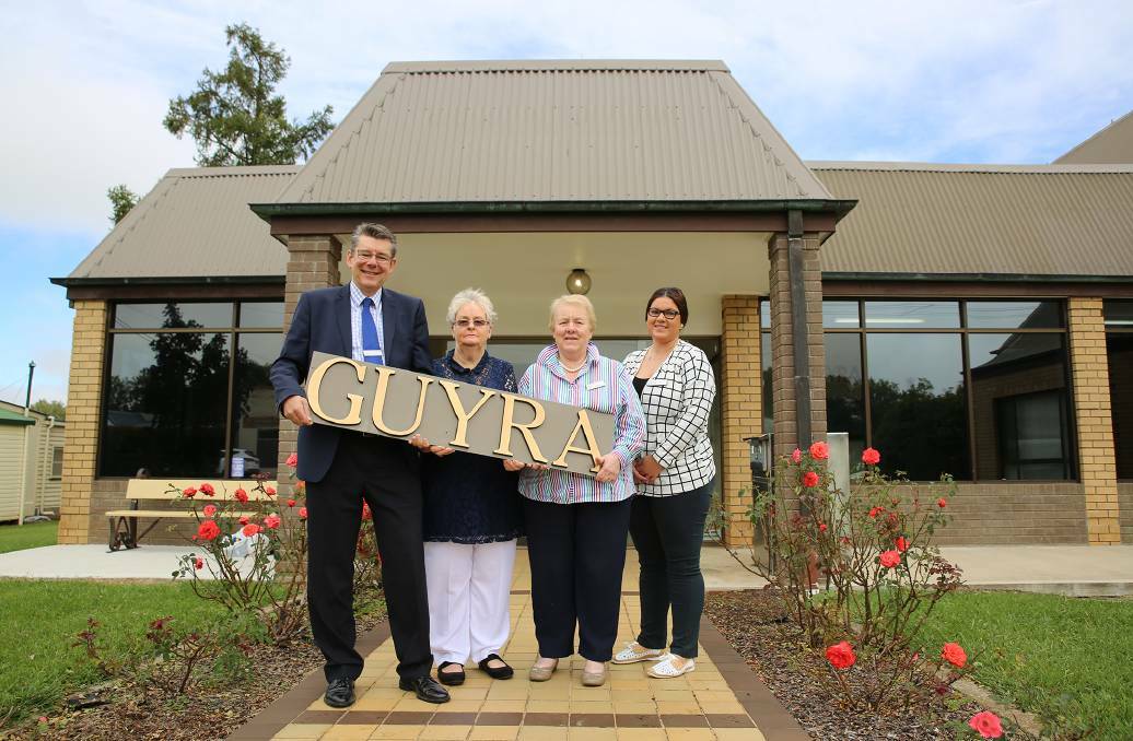 SAVED IN TIME: Council’s Lindsay Woodland presenting signs to Dorothy Lockyer, Dot Vickery and Tegan Mendes. Photo: Contributed.