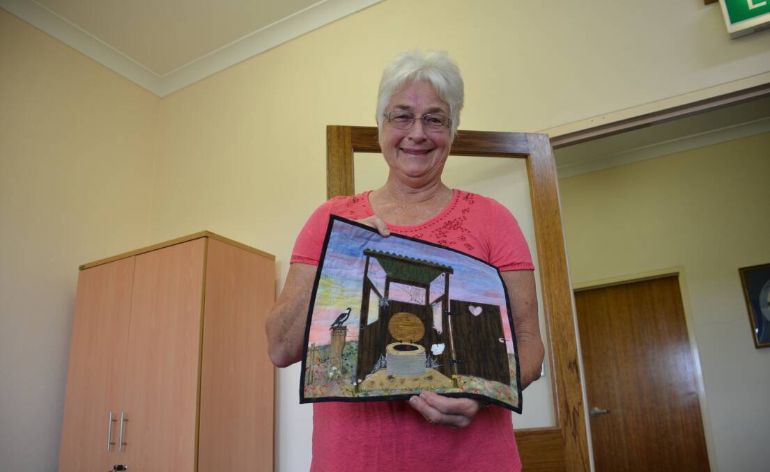 Conny Kinghorn with an item she painted herself.