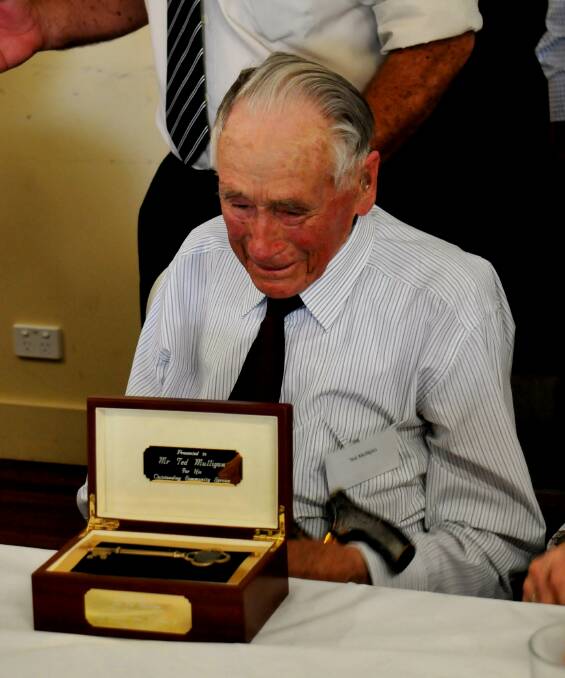 Unlocking a legend: Guyra resident Ted Mulligan is presented the key to Guyra by Senator John Williams and Hans Hietbrink in recognition of his contribution to the community, just days before celebrating his 100th birthday.