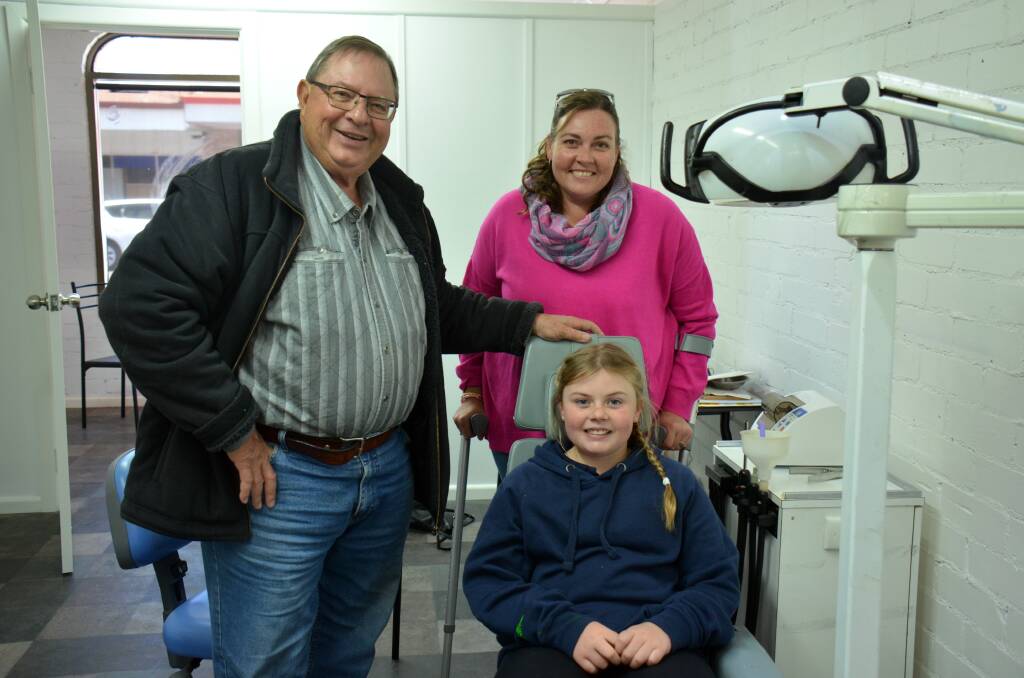 HAPPY CLIENTS: Dr Cividin with Trisha McIlwain and Kiralee McIlwain in the chair at the new Guyra surgery on Tuesday morning. Photo: Rachel Baxter.