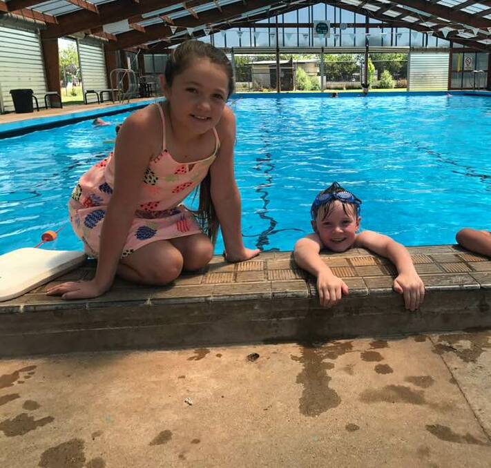 COOLING DOWN: Ella and Will Vidler cool down at the Guyra Town Pool this week as temperatures in Guyra and Armidale hit 30 degrees and over. The temperatures are higher than average for December. Photo: Rachel Baxter