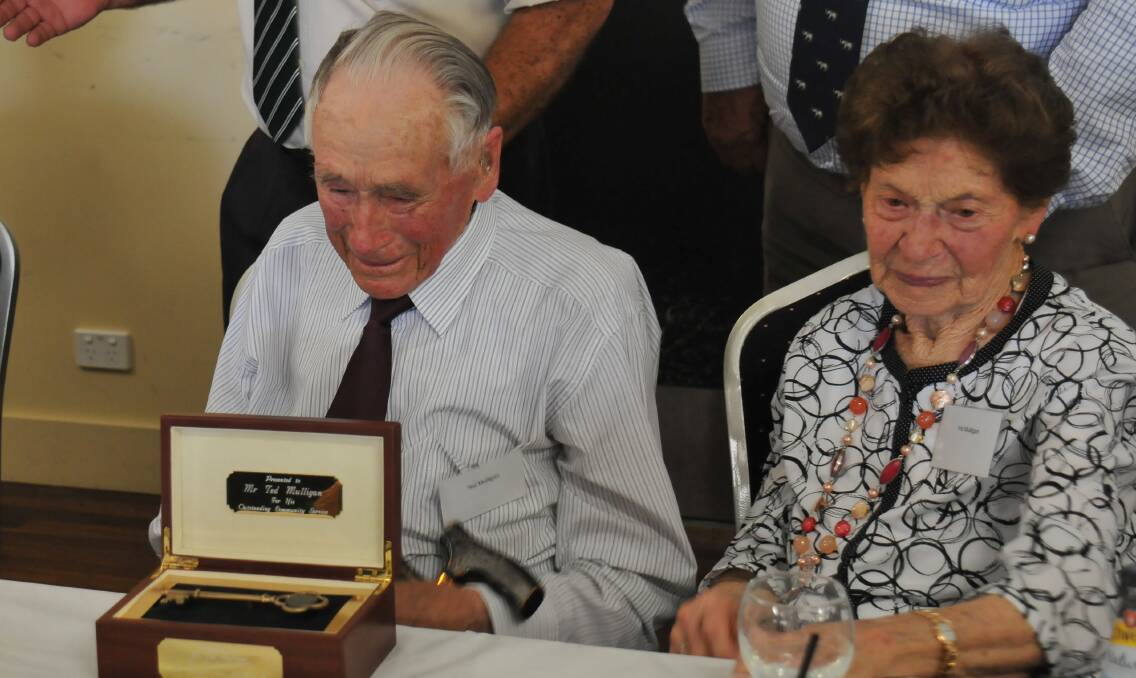 Unlocking a legend: Guyra resident Ted Mulligan is presented the key to Guyra by Senator John Williams and Hans Hietbrink in recognition of his contribution to the community, just days before celebrating his 100th birthday.