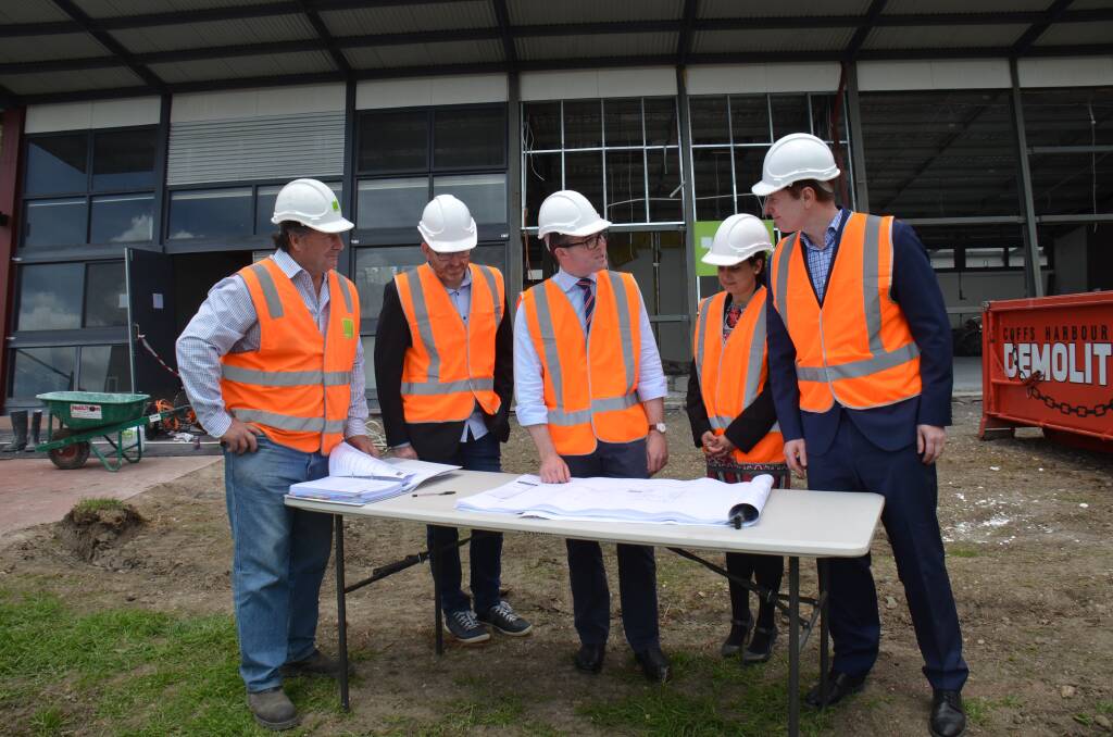OUT WITH THE OLD: Northern Tablelands MP Adam Marshall, left, looking over plans for the new TAFE Digital Headquarters yesterday with site foreman Tony Lulman, left, and newly recruited executives, Head of Digital Learning Lab Greg Higgins, Head of Product Management Deepa Salklan and Head of Digital Design Adam DeMooy.