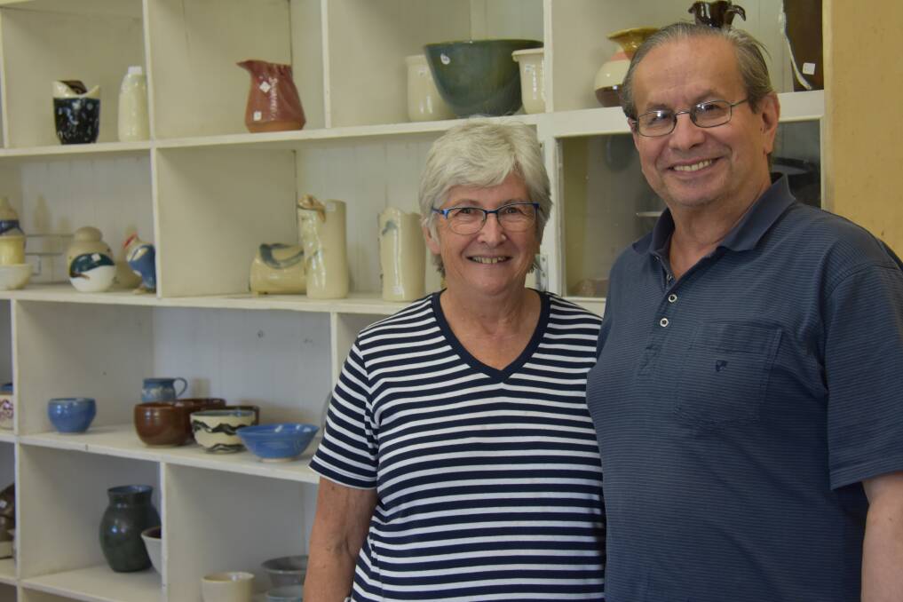 PASSIONATE POTTERS: Beth Ley and Joe Sartori are busy preparing for the Armidale Pottery Club's annual Christmas sale this weekend. Photo: Rachel Baxter