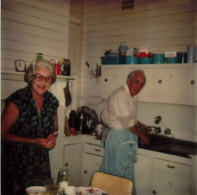 All smiles: The kitchen in Marsh Street ,Christmas 1979. Kathleen Vickers is on the left, and Jim Belshaw Snr is washing up. 