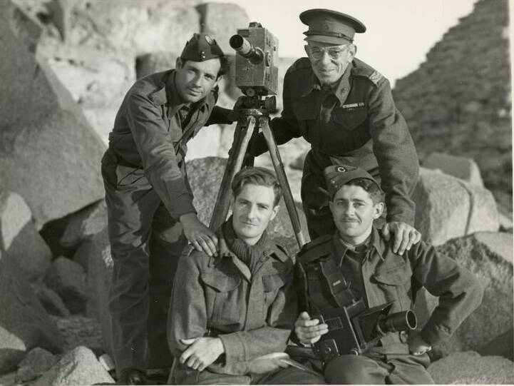 War photographers, New Guinea: (Back left) Damien Parer, Frank Hurley, (front left) Maslyn Williams and George Silk.
