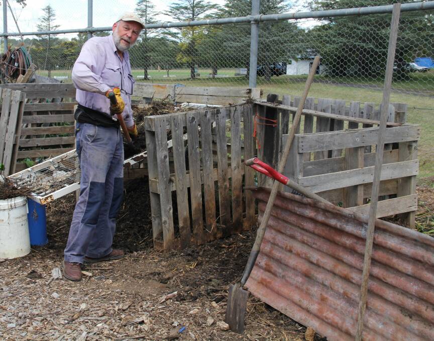 Super stuff: Tim Marshall building compost in the Armidale Community Garden.