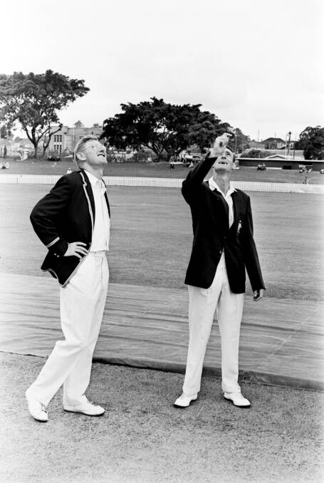 Fair play: Mike Smith and Brian Booth toss the coin to commence play at the Gabba for the Ashes series in December 1965. 